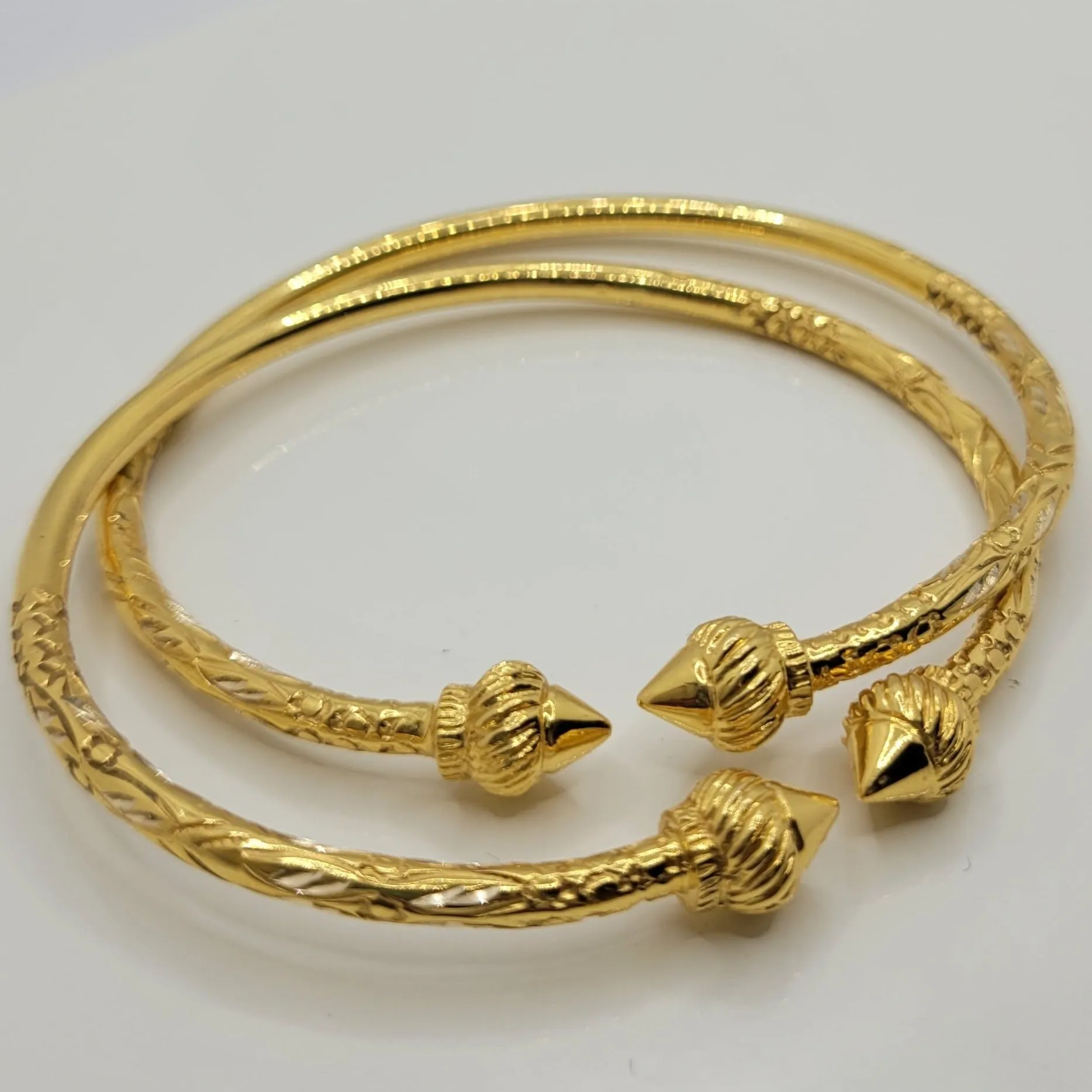 10k pair Traditional West Indian Bangles with twirl head