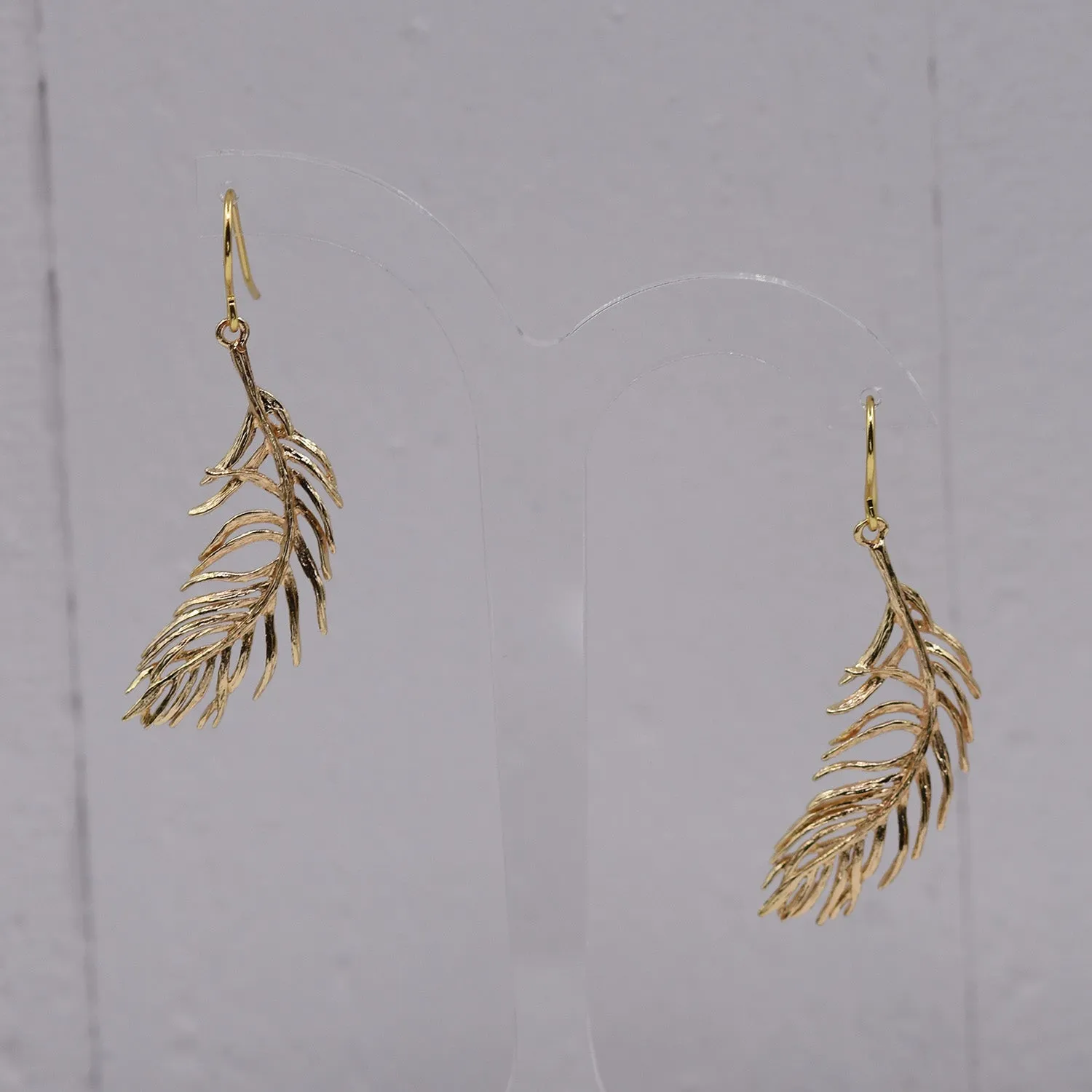 Delicate feather drop earring